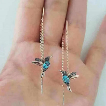 Pendientes de alambre con colibrí dorado y cristales